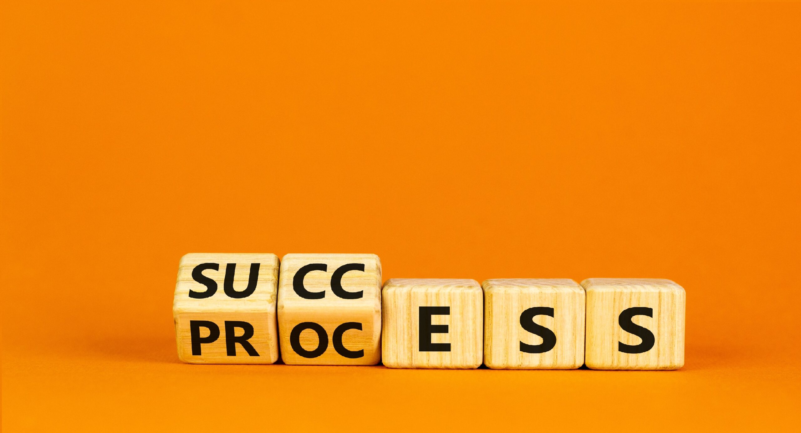 Success,Business,Process,Symbol.,Turned,Wooden,Cubes,With,Words,'success